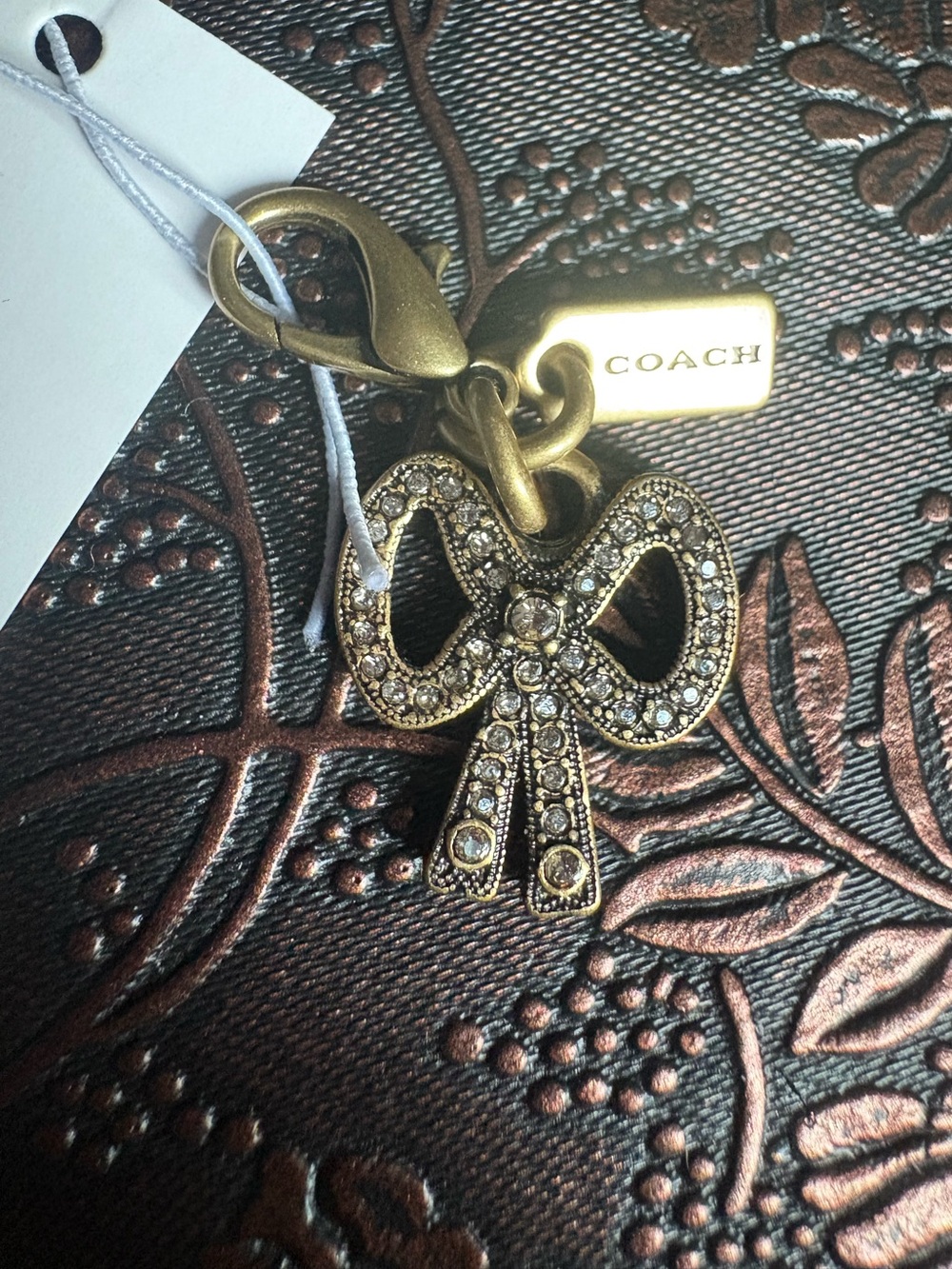 COACH Gold-Tone Crystal Bow Key Charm